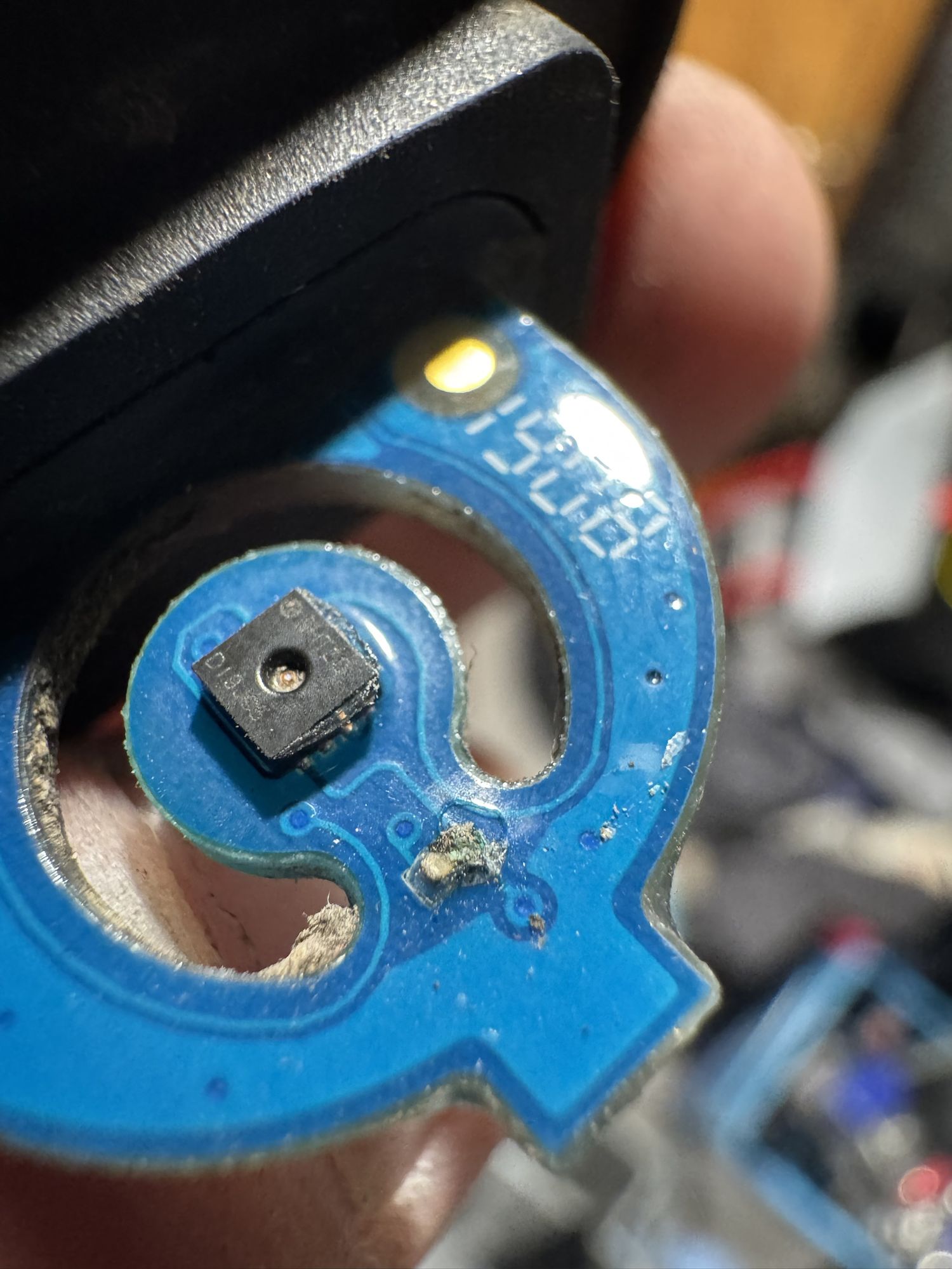 Blue sensor board with an SHT30; the part next to it is covered in grey-green corrosion
